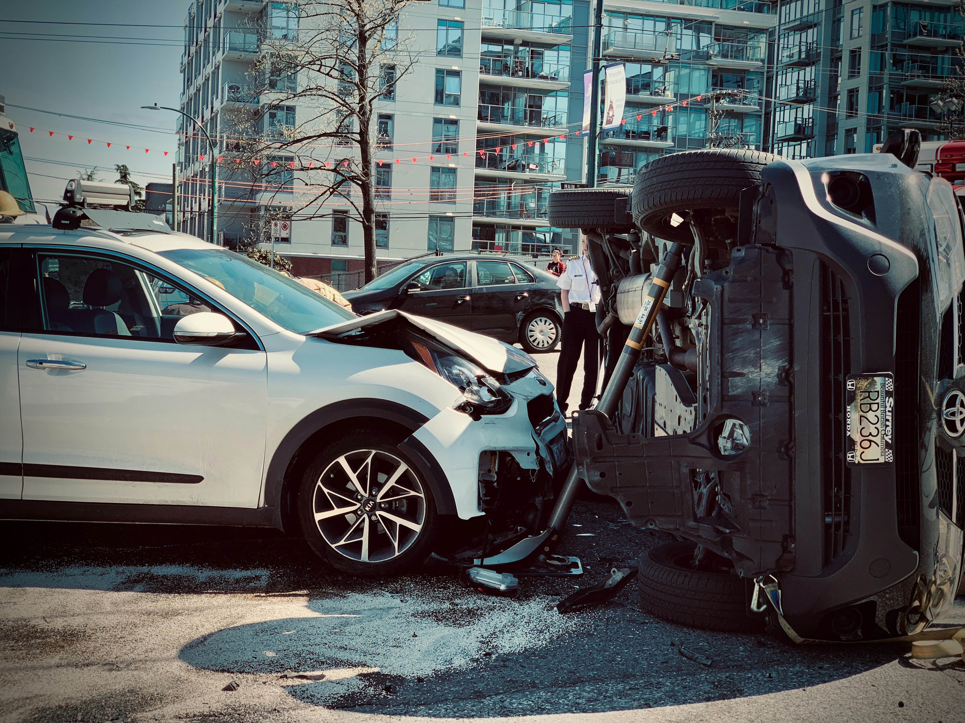 A person on the phone filing a car insurance claim after an accident.